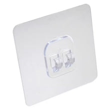 Self-adhesive wall hook holding a towel neatly in a modern bathroom.