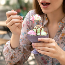 Close-up of stainless steel dessert cups with stand