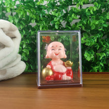 Side view of the solar-powered nodding Buddha statue, designed for positive energy in your car.
