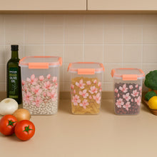 Close-up of the orange clip-lock lid on a floral airtight storage container.