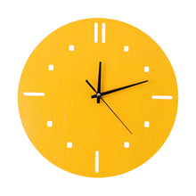A vibrant yellow round wall clock with minimalist hour markers and black hands is isolated on a white background.