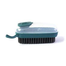 Close-up of the dispensing laundry cleaning brush in use