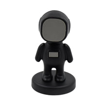 Side view of the stylish Cartoon Astronaut Car Mobile Holder on a dashboard.