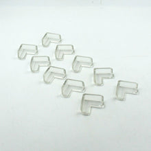 Multiple clear corner guards effectively applied to sharp furniture edges in a home.