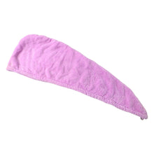 A light pink microfiber hair wrap towel laid flat on a white background.