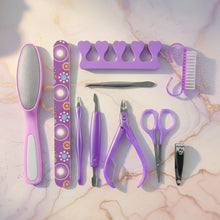 Stainless steel manicure and pedicure tools arranged neatly in the grooming set