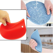 Stylish silicone trivet hot pad placed on a modern kitchen counter.