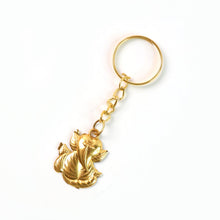 Detailed leaf design on golden Ganesh metal keychain