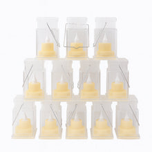 Transparent storm lantern with warm LED candle inside, flameless