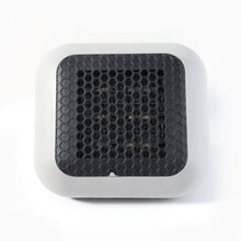 Small room warmed by the compact 600W plug-in wall-mounted room heater