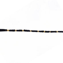 Red Mauli rakhi with gold and pearl details for festival