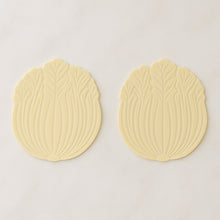 Silicone leaf coaster protecting surface from heat and moisture with hot beverage