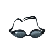 Black swimming goggles with clear lenses and an adjustable strap are displayed on a white background.