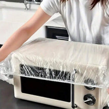 Elasticated plastic couch protector securely fitted over a sofa.