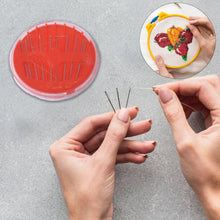 Close-up of needle threader tool in the sewing kit