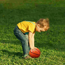Person actively using the Football Rebounder for solo practice, demonstrating its effectiveness.