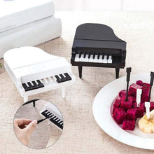 The 10-piece piano fruit forks set showcased in its packaging, ideal for gifting unique kitchen tools.