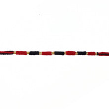 Red and black thread Rakhi with detailed craftsmanship