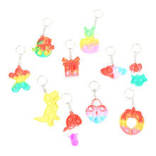 A Pop It Keychain attached to a backpack, demonstrating its portability as a fidget toy.