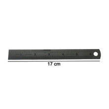 Close-up showing detailed markings on steel measuring ruler