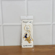 Krishna keychain with multiple charms and sturdy metal key ring