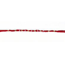 Red mauli rakhi with decorative beads and golden details