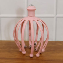 Scalp massager with rolling ball tips, promoting blood circulation.