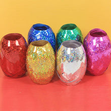 Multicolor curling ribbon rolls displayed for festive party decorations.