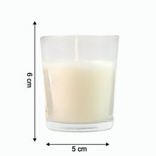 Close-up of a lit Blueberry Scented Votive Candle, showing the gentle flame.