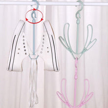 Organivo shoe drying hanger demonstrating its capacity for various shoe types.