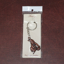 Side view of Bal Krishna metal keychain with sturdy chain and ring