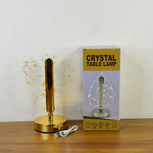 The golden butterfly lamp next to its product box, which shows a different lamp design.