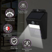 Sun-powered mosquito zapper and outdoor light mounted near a doorway.