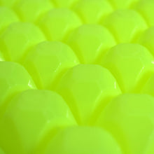 A stream of water filling the easy release ice tray cavities.