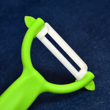 The complete Ceramic Knife Set, featuring a utility knife and a peeler, on a kitchen counter.