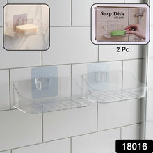 Close-up view of clear transparent soap dish holder mounted on bathroom wall