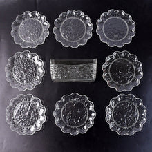 9-piece plastic bowl set with serving tray displaying transparent bowls and plates