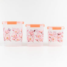 Stackable floral food storage container set with transparent bodies.