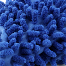Microfiber wash mitt gently cleaning a car's painted surface.