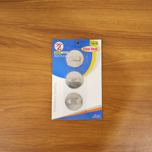 A practical stainless steel hook holding a kitchen towel, enhancing kitchen organization.