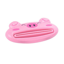 Foldable home office lap desk with a small pink pig tube squeezer in view.