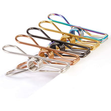 Pile of heavy-duty stainless steel clips, showcasing their robust construction for multipurpose use.