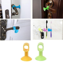 A collage of four images showing the silicone door stoppers in use on door handles and holding toothbrushes.