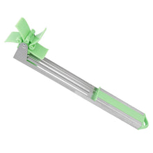 The sleek stainless steel watermelon cutter displayed on a modern kitchen counter.
