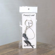 Compact metal rifle gun keychain attached to a keyring for everyday use