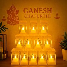A pyramid of twelve clear plastic lanterns with glowing LED candles on an orange background with Ganesh Chaturthi text.