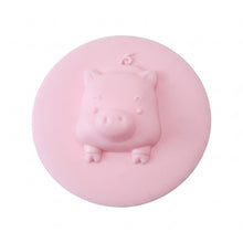Silicone drain cover with pig design presented on a clean white background.