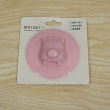 Silicone drain cover in its retail card packing, ready for purchase.