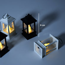 Group of flameless candle lanterns arranged for home decoration.