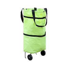 User effortlessly pulling the FERVENT foldable trolley bag with its durable wheels.